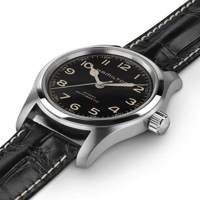 Hamilton manufacturer photograph of the Murph laid at an angle, showing its steel case, lugs and black leather strap.